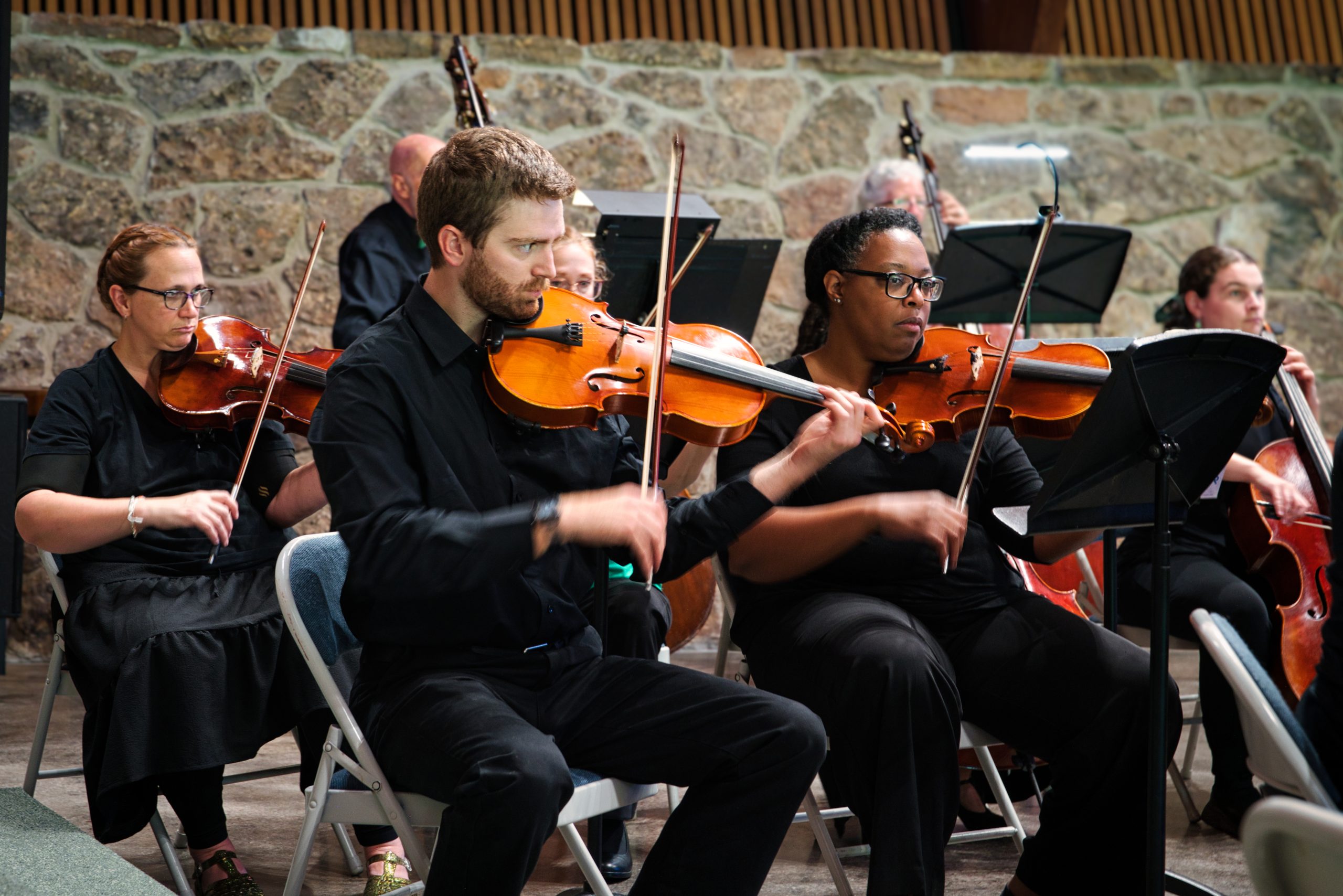 Alisa Weigel, Karl Aston, and Hilda Bernard performing